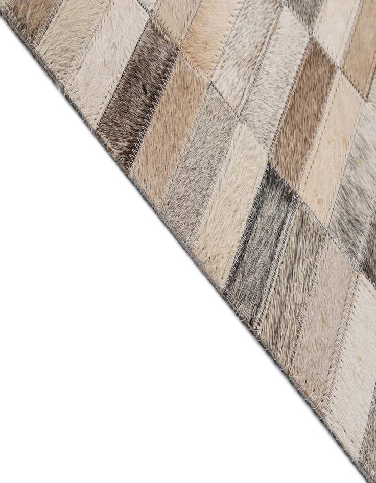Detail image of  5' 2 x 7' 11 Cowhide - Patchwork Rug