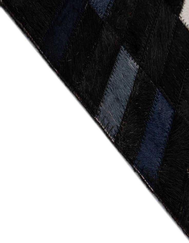 Detail image of  5' 2 x 8' Cowhide - Patchwork Rug