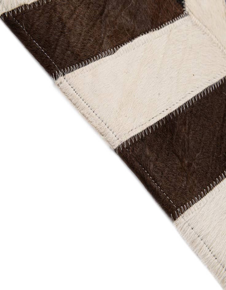 Detail image of  5' 1 x 7' 11 Cowhide - Patchwork Rug