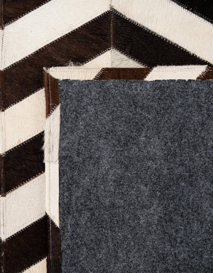 Detail image of  5' 1 x 7' 11 Cowhide - Patchwork Rug
