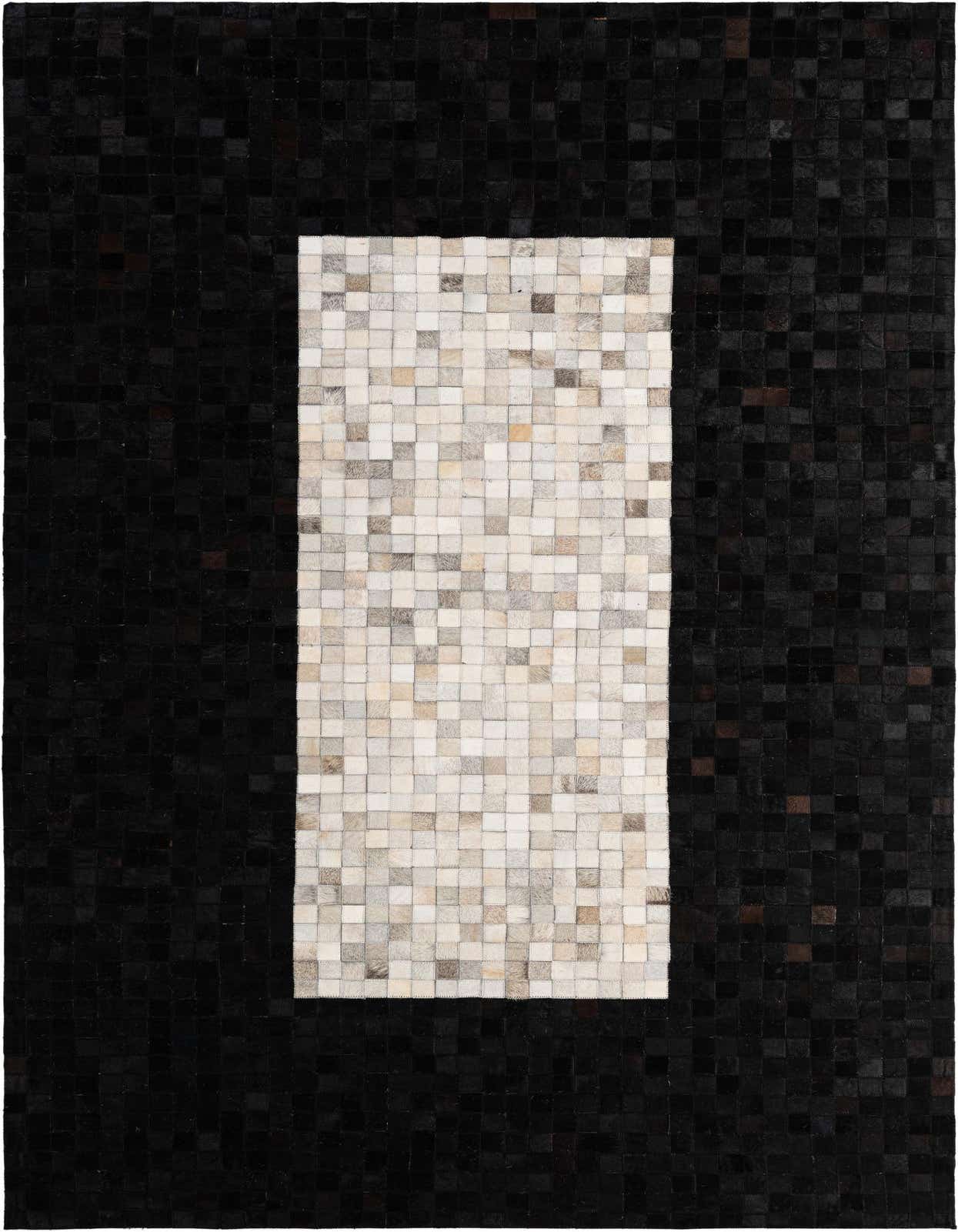A rectangular 5x8 modern patchwork cowhide rug with a black border and a multi-colored white, grey, and brown center.