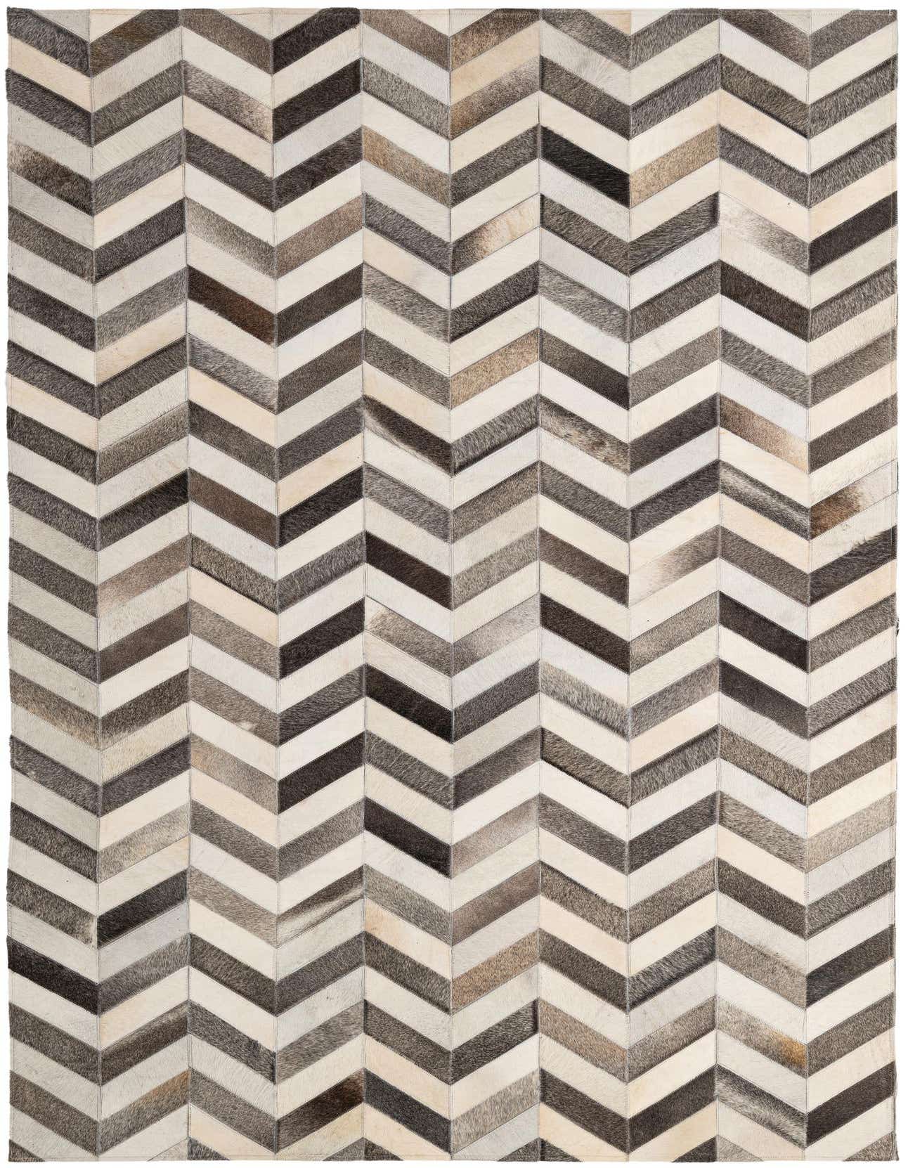 A 5x8 rectangular cowhide rug featuring a modern chevron pattern in various shades of brown, gray, and cream.