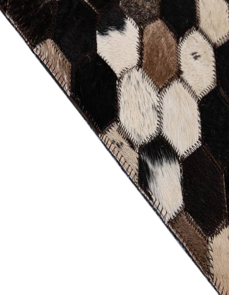 Detail image of  5' 1 x 7' 11 Cowhide - Patchwork Rug