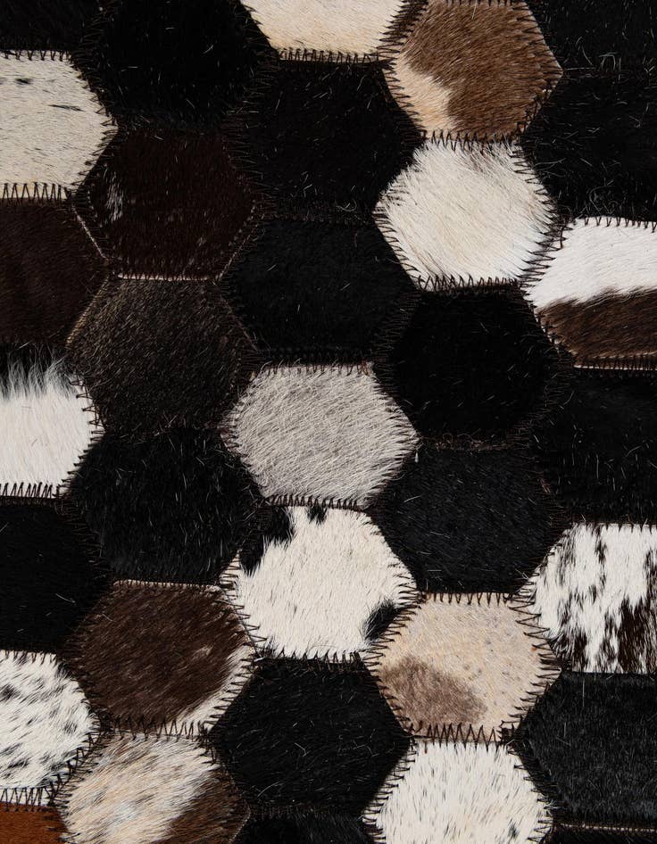 Detail image of  5' 1 x 7' 11 Cowhide - Patchwork Rug