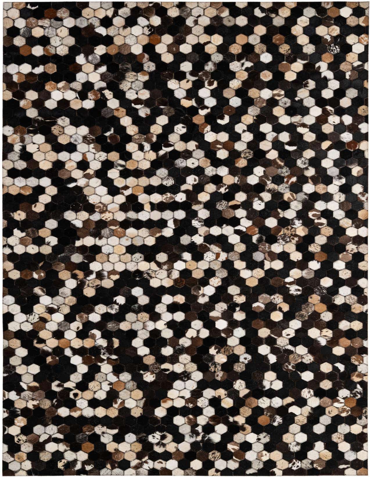 A rectangular 5x8 modern rug made of multi-colored cowhide and leather hexagons, perfect for a living room.