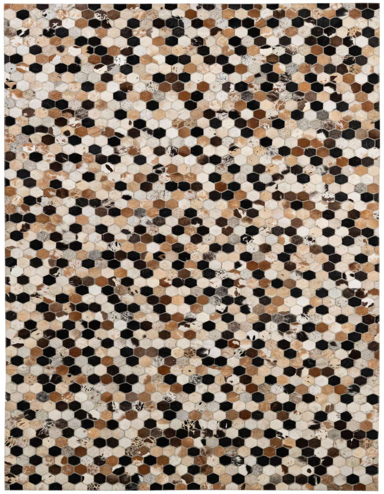 A 5x8 rectangular Cowhide Patchwork rug with a modern hexagonal pattern in various shades of brown, black, and cream.