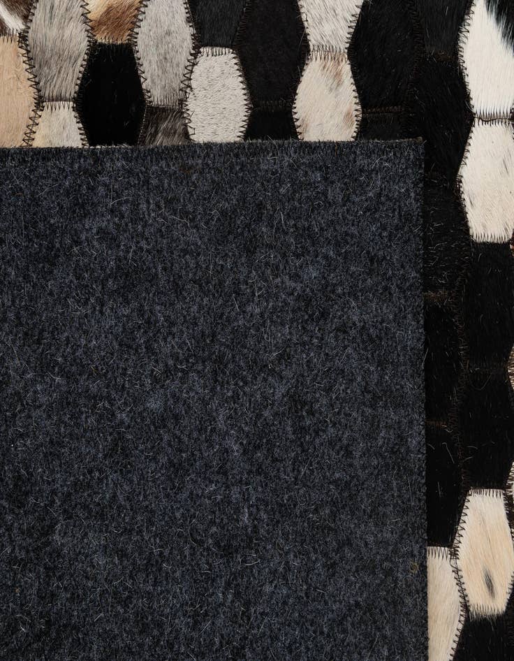 Detail image of  5' 1 x 8' 1 Cowhide - Patchwork Rug