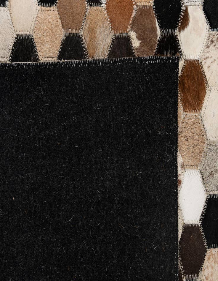 Detail image of  5' 1 x 8' 1 Cowhide - Patchwork Rug