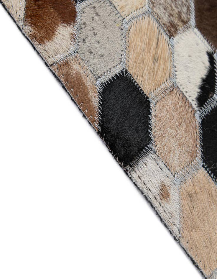 Detail image of  5' 1 x 7' 11 Cowhide - Patchwork Rug