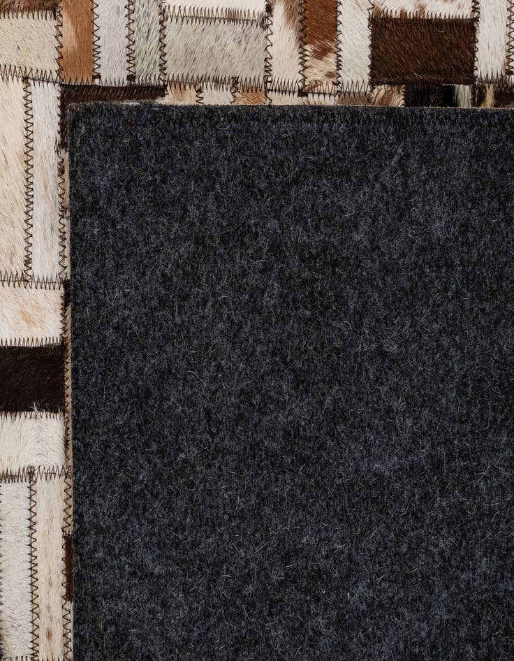 Detail image of  5' 2 x 7' 11 Cowhide - Patchwork Rug