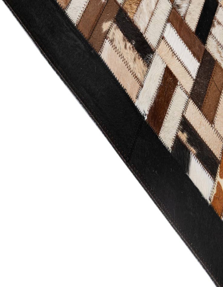 Detail image of  5' 1 x 7' 11 Cowhide - Patchwork Rug
