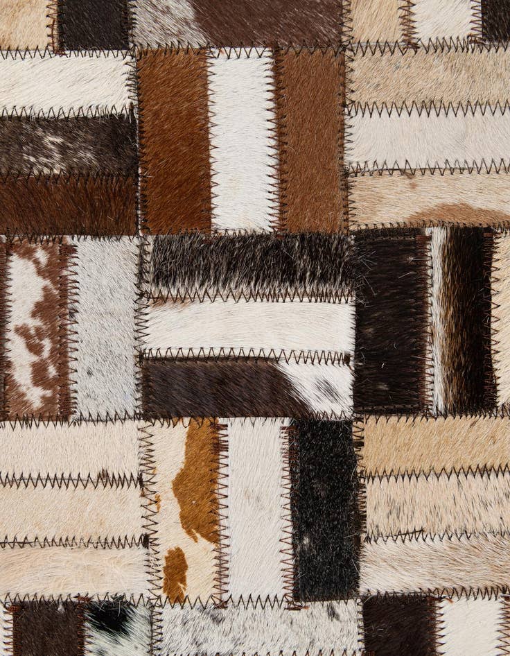 Detail image of  5' 1 x 7' 11 Cowhide - Patchwork Rug