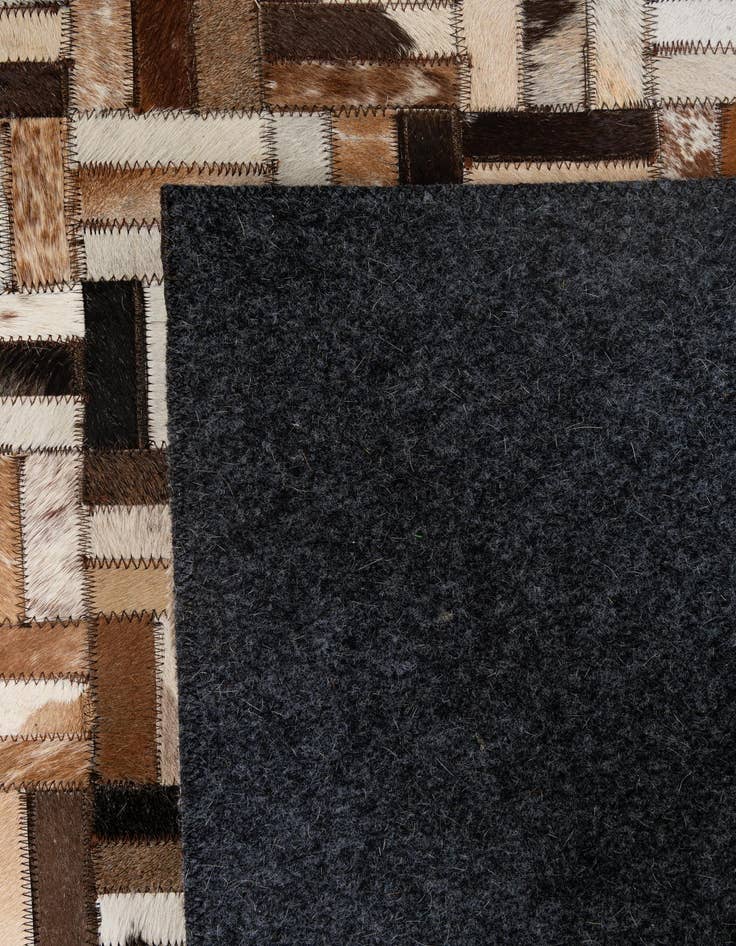 Detail image of  5' 1 x 7' 11 Cowhide - Patchwork Rug