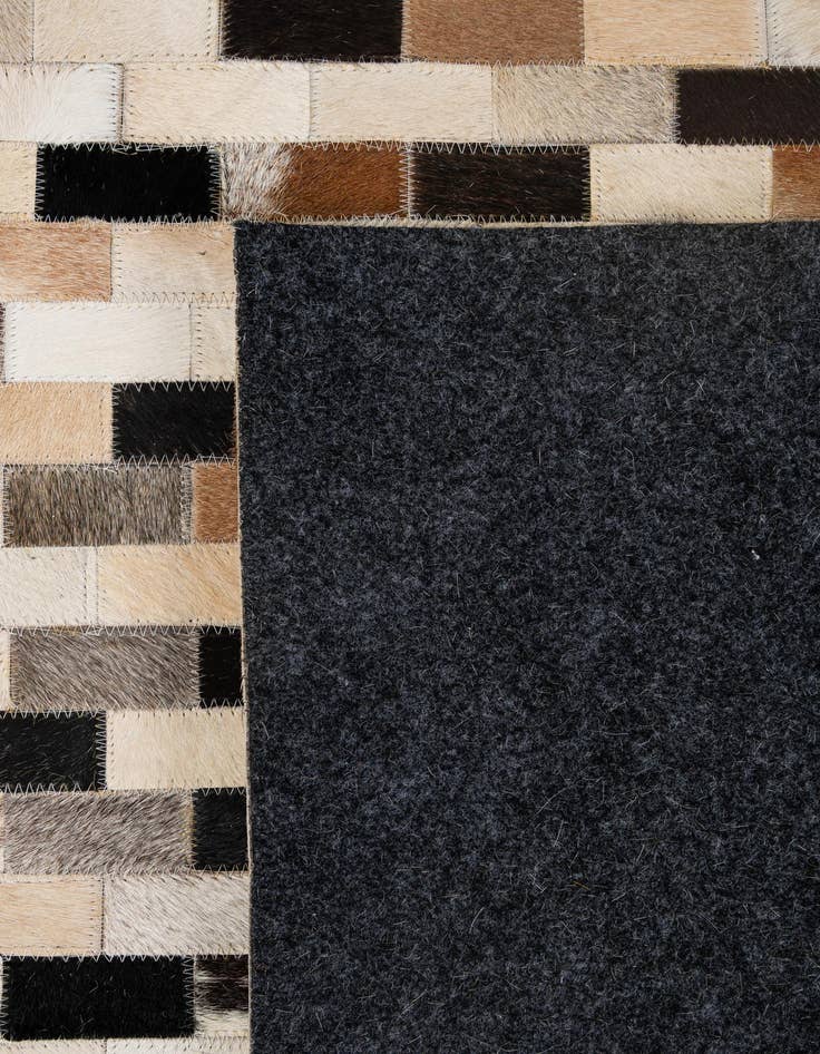 Detail image of  5' 1 x 7' 11 Cowhide - Patchwork Rug