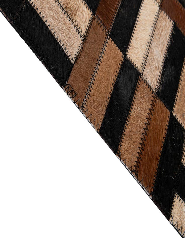 Detail image of  4' 11 x 7' 10 Cowhide - Patchwork Rug