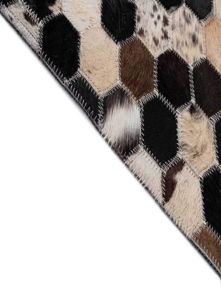 Detail image of  5' 1 x 7' 11 Cowhide - Patchwork Rug