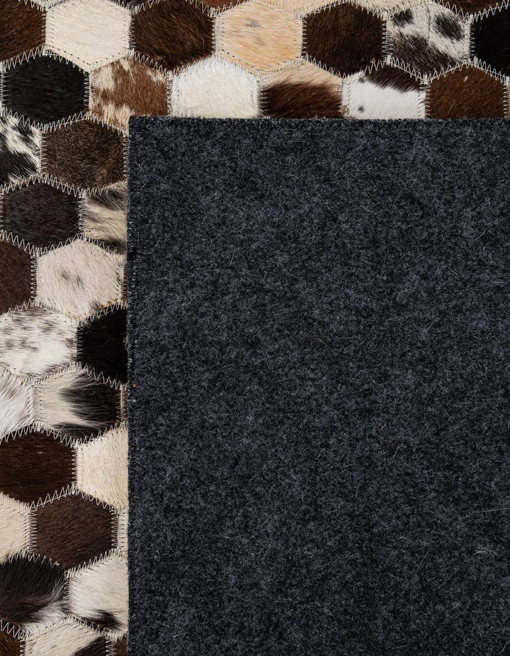 Detail image of  5' 1 x 7' 11 Cowhide - Patchwork Rug