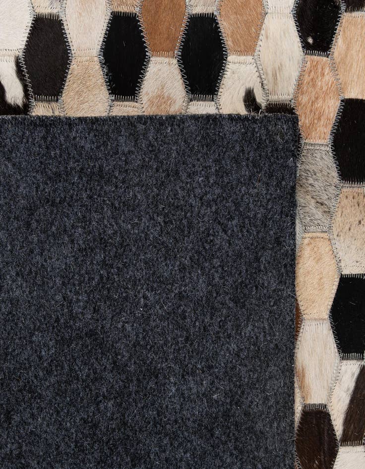 Detail image of  5' 1 x 7' 11 Cowhide - Patchwork Rug