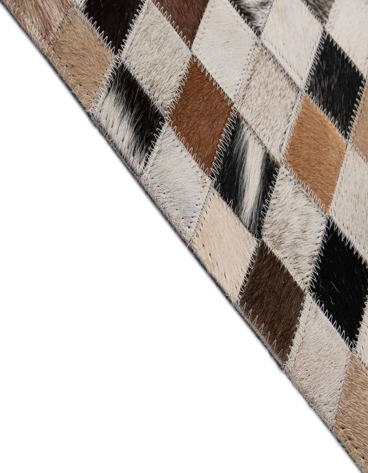 Detail image of  4' 11 x 7' 10 Cowhide - Patchwork Rug