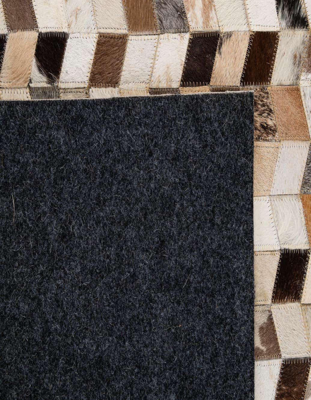 Primary image  5' x 7' 11 Cowhide - Patchwork Rug