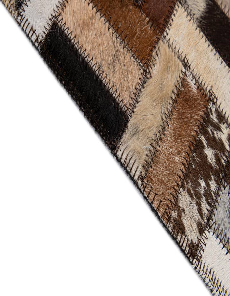 Detail image of  4' 11 x 7' 10 Cowhide - Patchwork Rug