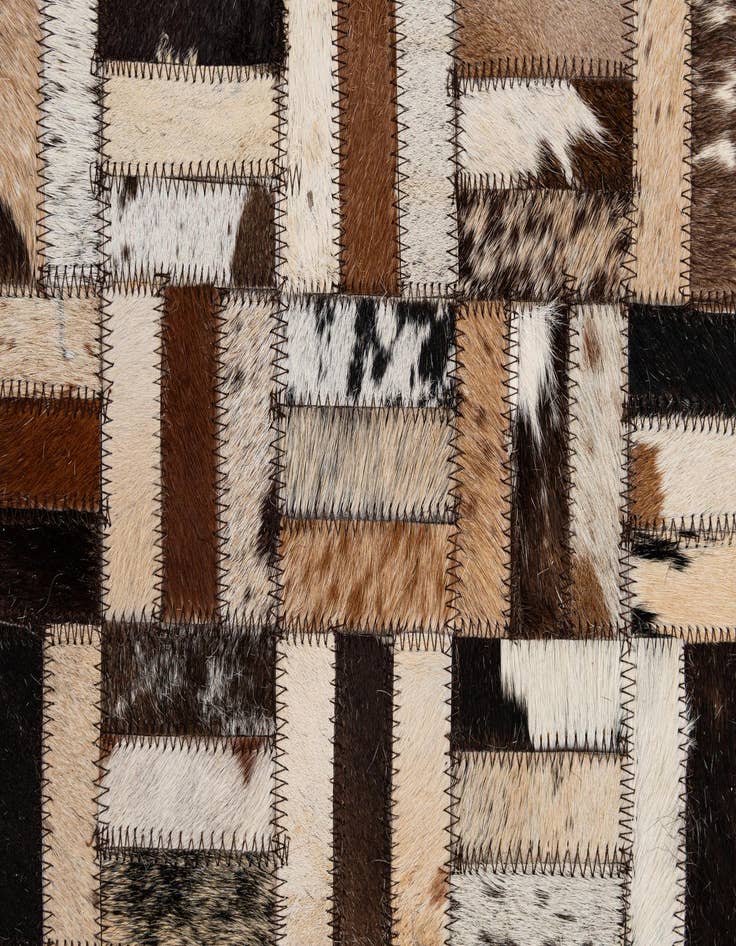 Detail image of  4' 11 x 7' 10 Cowhide - Patchwork Rug