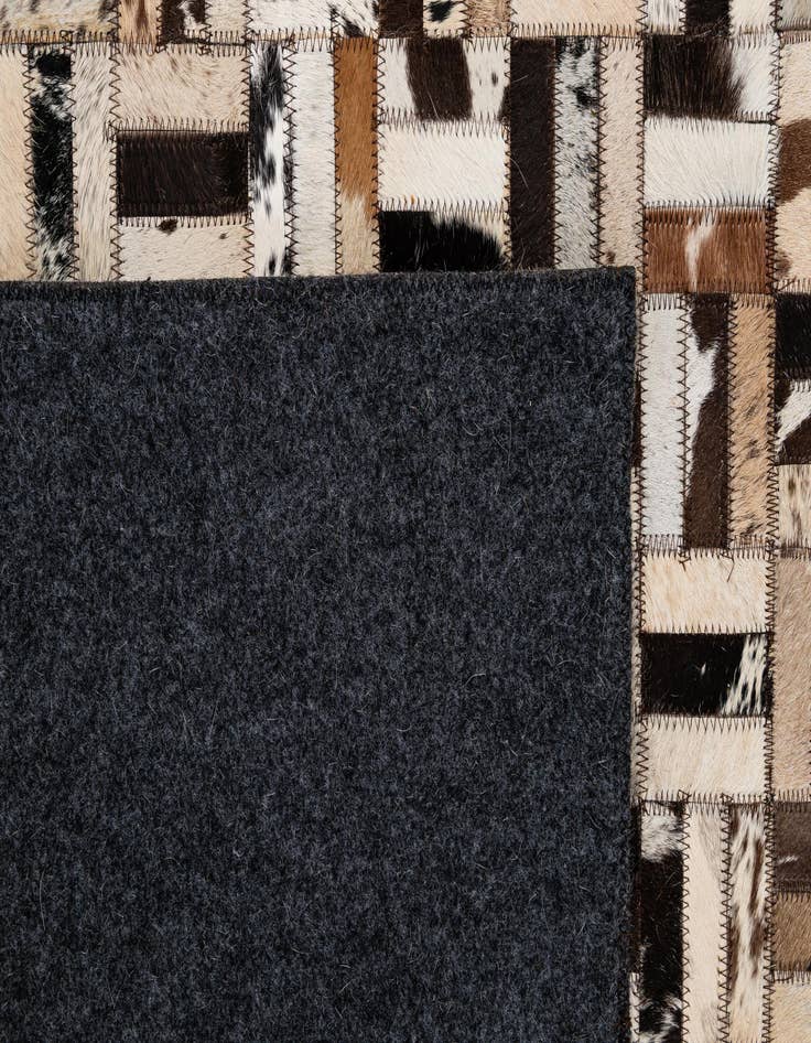 Detail image of  4' 11 x 7' 10 Cowhide - Patchwork Rug