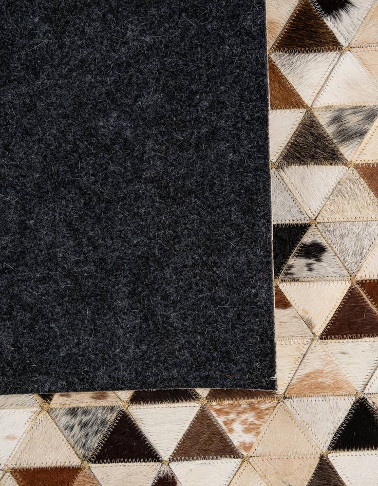 Detail image of  5' 1 x 7' 11 Cowhide - Patchwork Rug