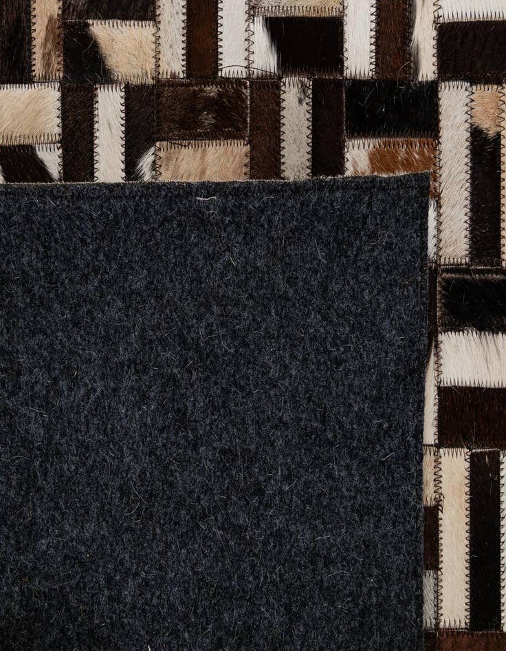 Detail image of  5' 2 x 7' 11 Cowhide - Patchwork Rug