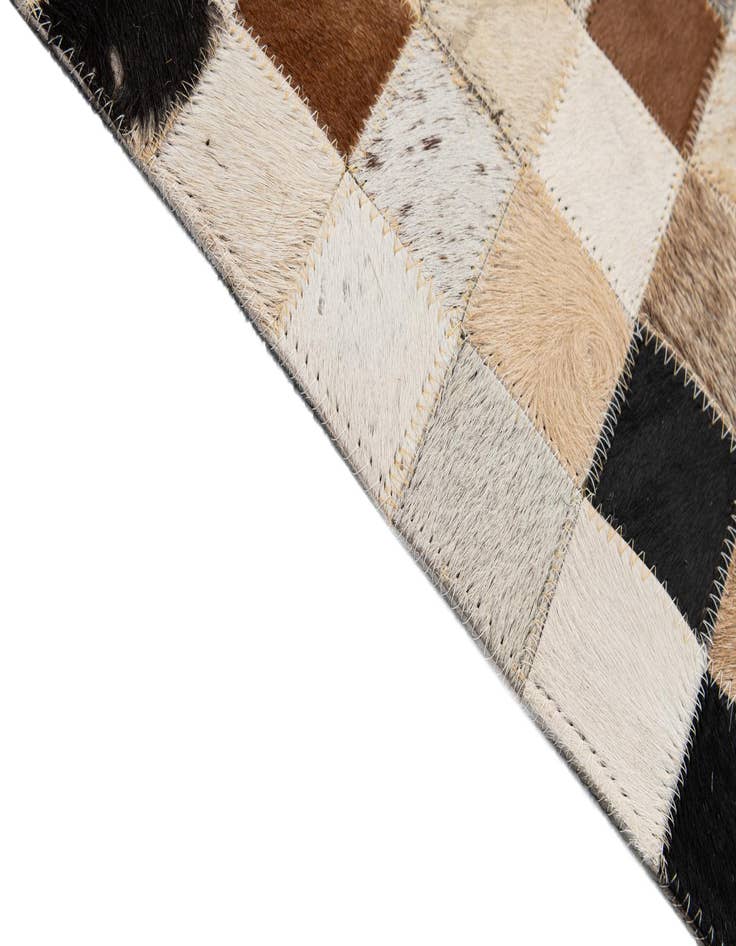 Detail image of  5' 1 x 7' 11 Cowhide - Patchwork Rug