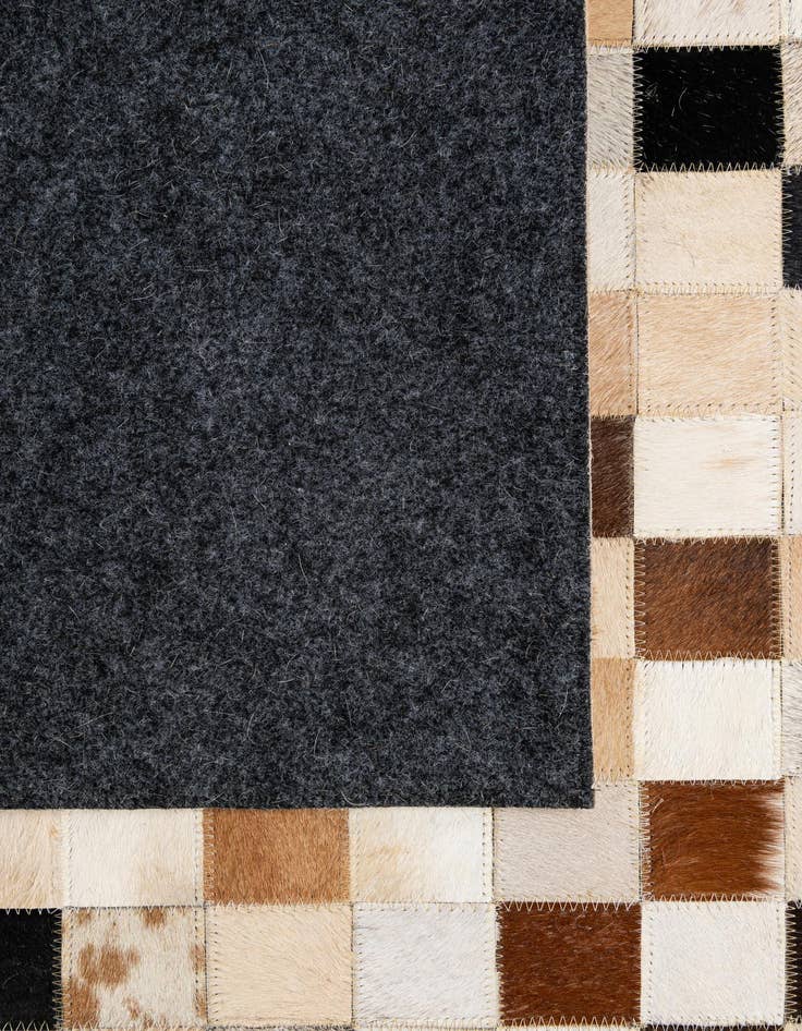 Detail image of  5' 1 x 7' 11 Cowhide - Patchwork Rug