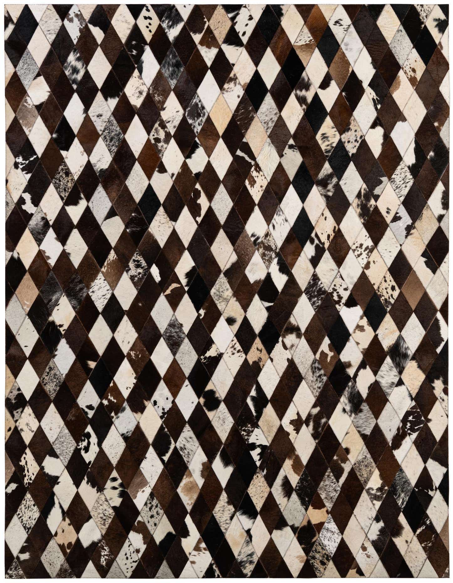 A 6x9 rectangular cowhide rug featuring a modern patchwork diamond pattern in shades of brown, black, and white.