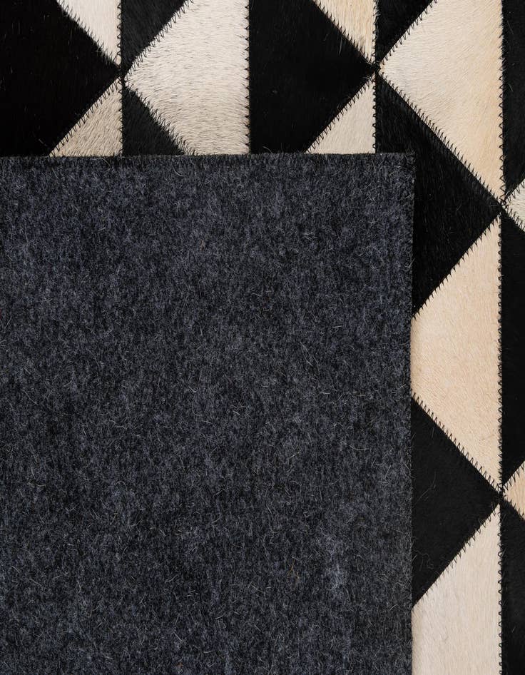 Detail image of  5' 2 x 8' 2 Cowhide - Patchwork Rug