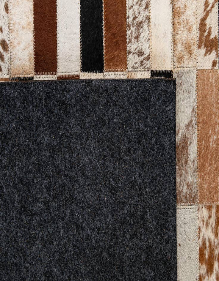 Detail image of  5' 1 x 7' 11 Cowhide - Patchwork Rug