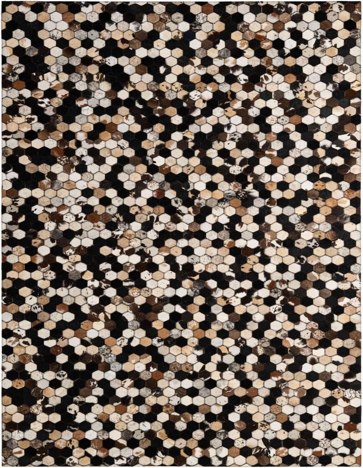 A rectangular 5x8 modern patchwork cowhide rug with multi-colored hexagonal tiles in black, brown, and cream tones.
