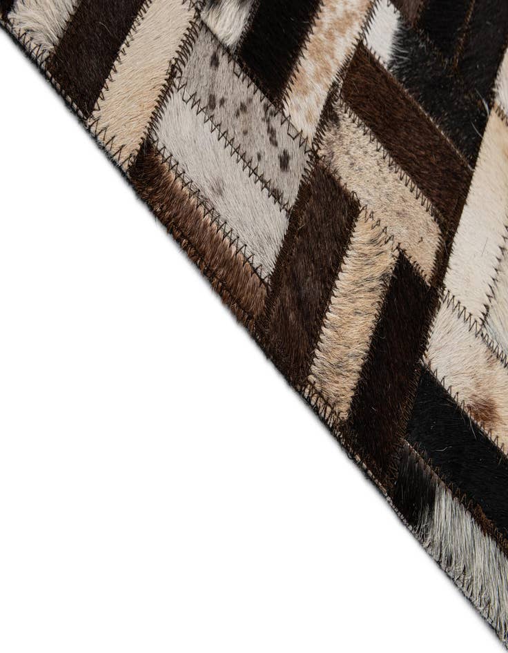 Detail image of  4' 11 x 7' 10 Cowhide - Patchwork Rug