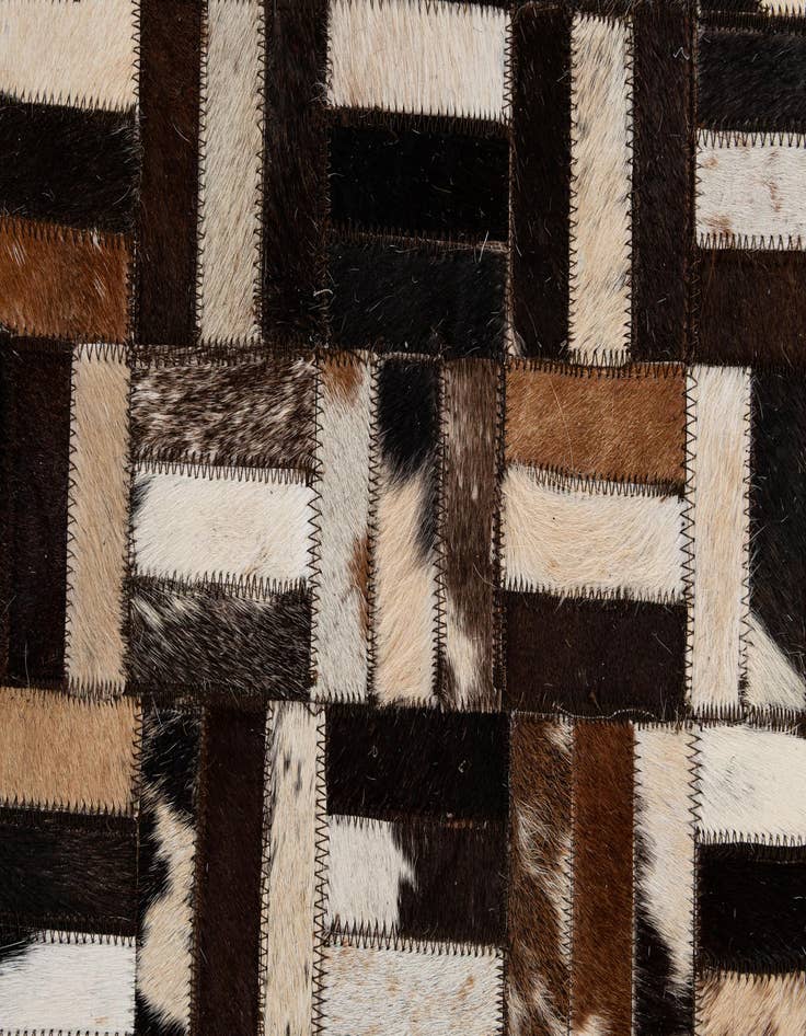Detail image of  4' 11 x 7' 10 Cowhide - Patchwork Rug