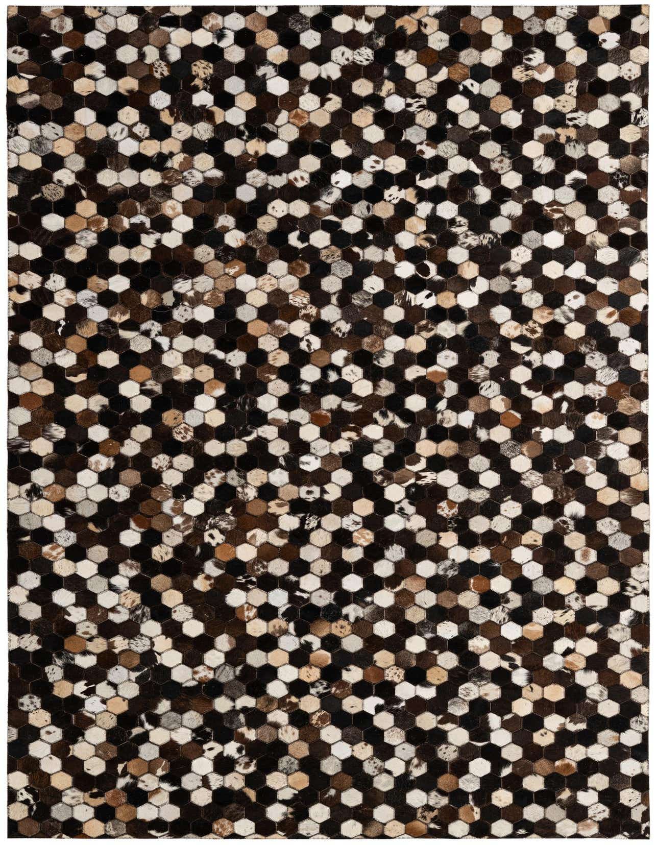A 5x8 rectangular Cowhide Patchwork rug featuring a modern geometric pattern of multi-colored hexagonal cowhide and leather patches.