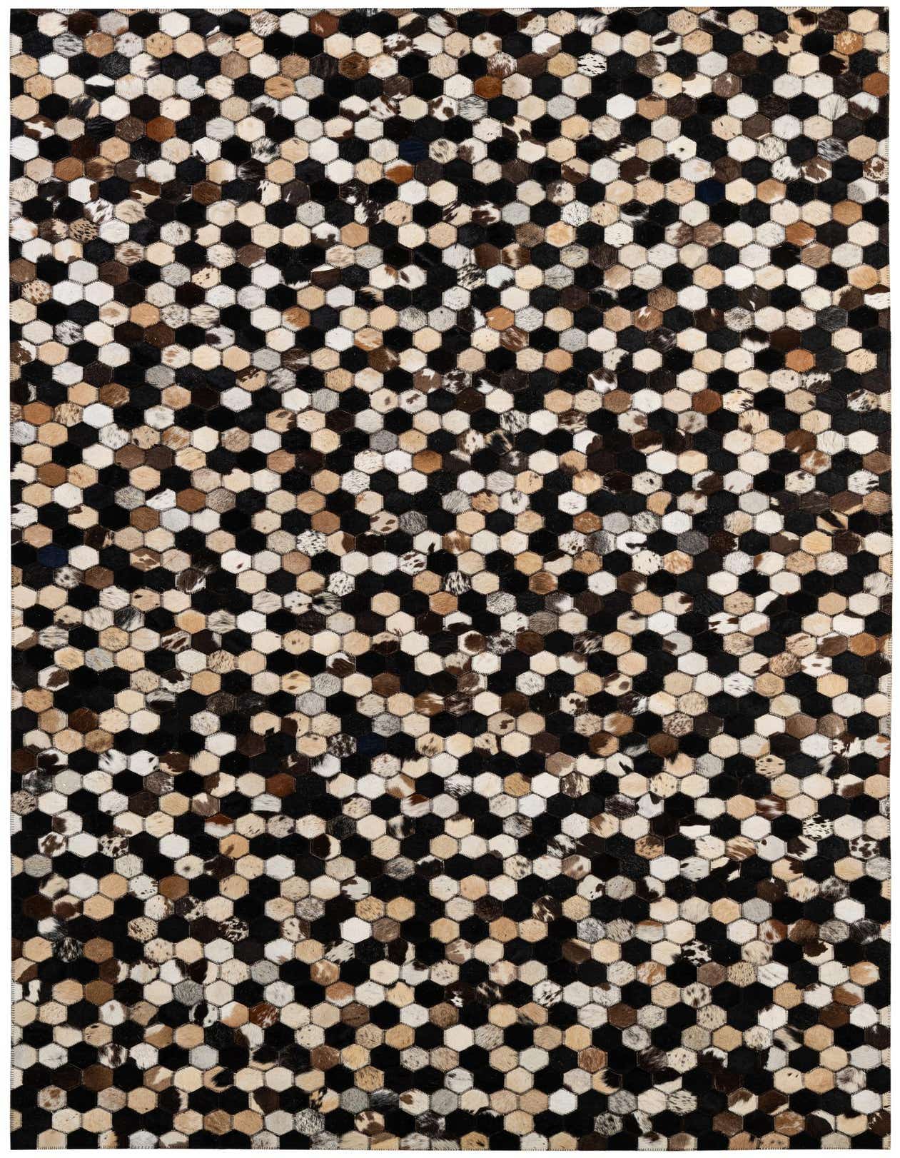 A 5x8 rectangular Cowhide Patchwork rug featuring a modern honeycomb pattern in various shades of black, brown, and cream.