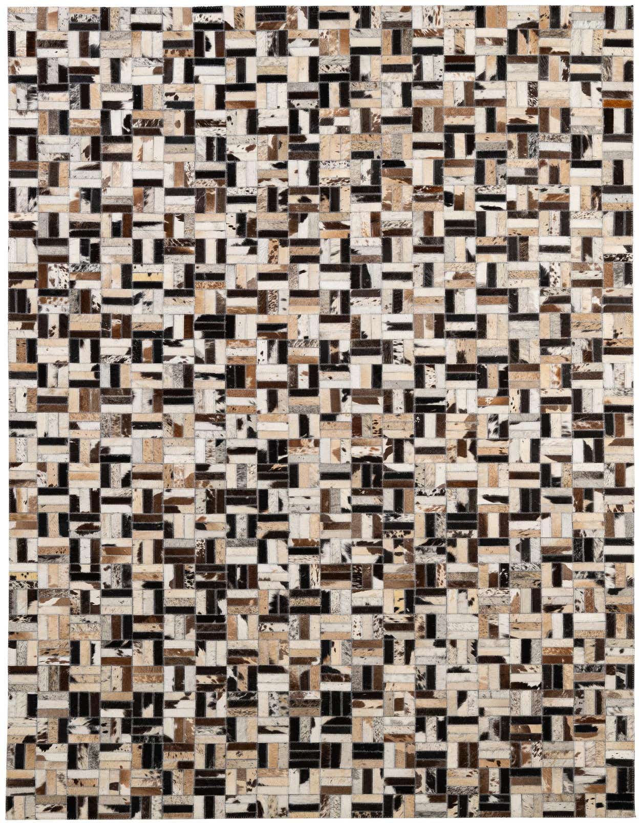 A rectangular 5x8 modern patchwork rug made from multi-colored cowhide and leather, featuring varied natural tones in a stripe pattern.