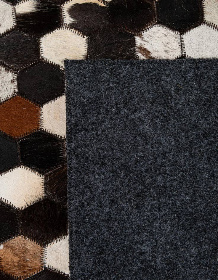 Detail image of  5' 1 x 7' 11 Cowhide - Patchwork Rug