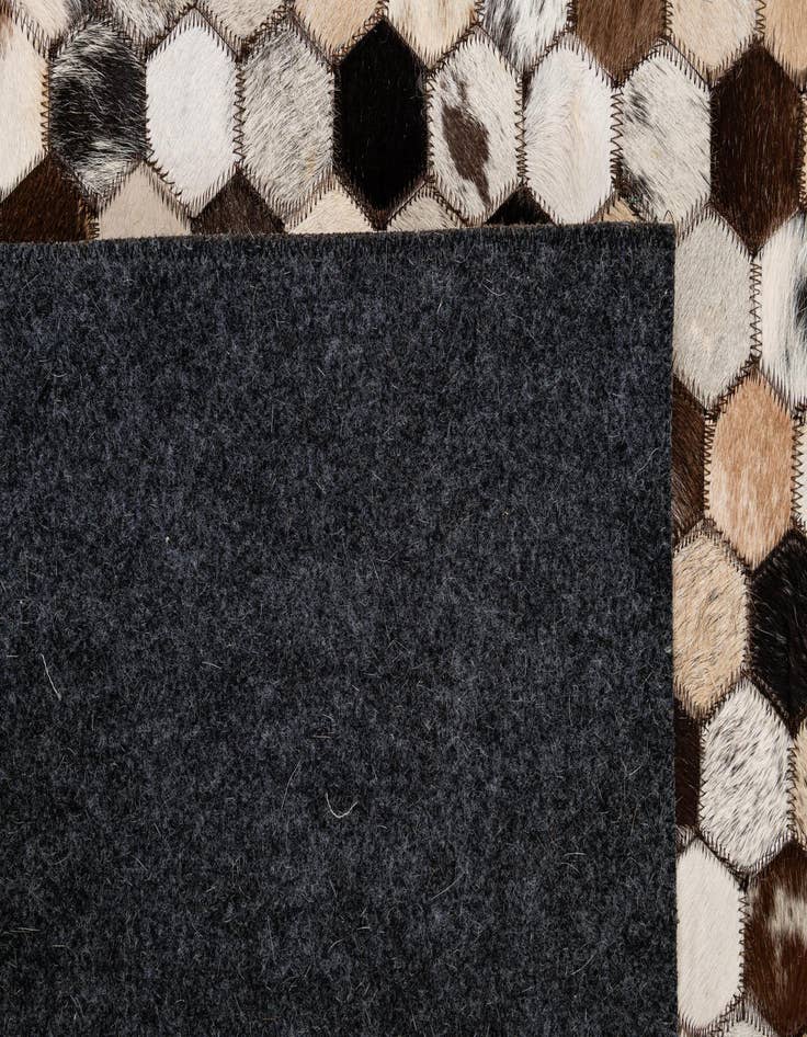 Detail image of  5' 1 x 7' 11 Cowhide - Patchwork Rug