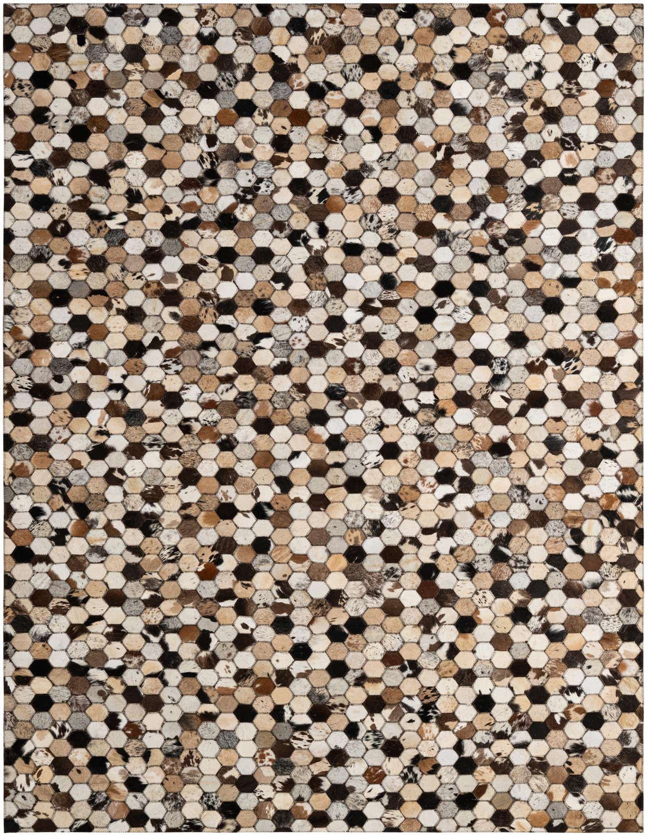 A 5x8 rectangular Cowhide Patchwork rug featuring a mosaic of hexagonal pieces in various natural multi-colored cowhide patterns.
