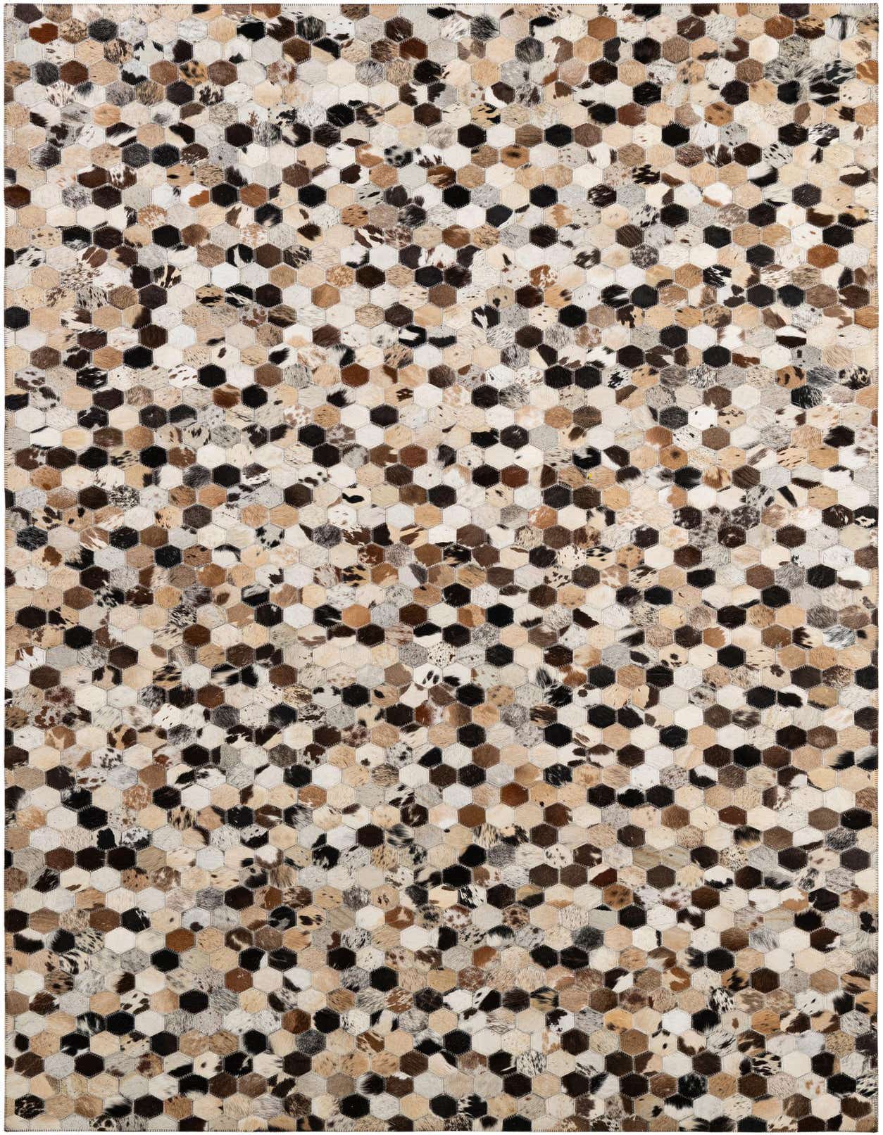 A 5x8 rectangular Cowhide Patchwork rug featuring a modern honeycomb pattern in various shades of brown, black, and cream.