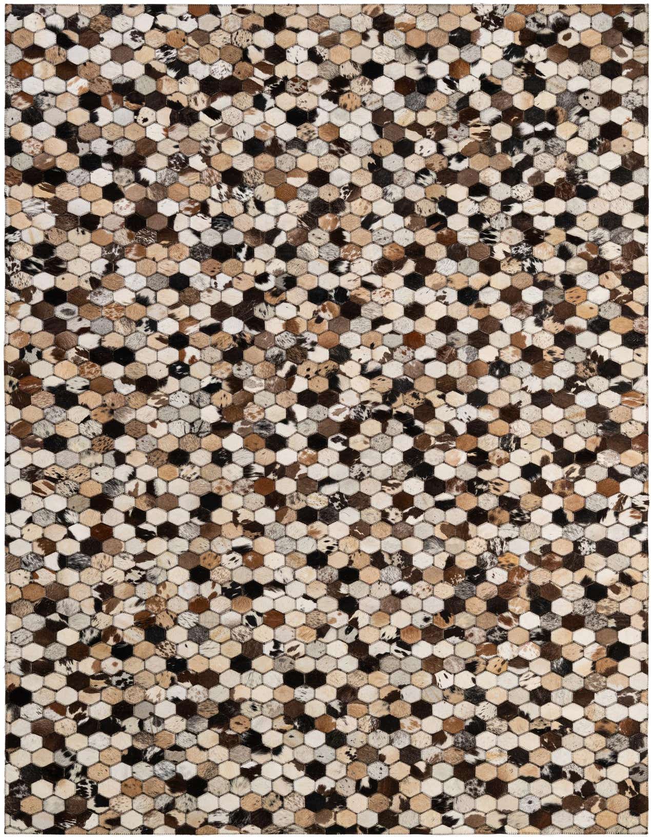 A 5x8 rectangular Cowhide Patchwork rug with a modern hexagonal pattern in various shades of brown, black, and white.