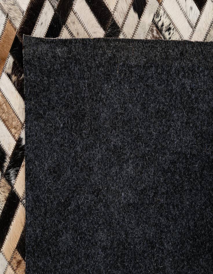 Detail image of  4' 11 x 7' 10 Cowhide - Patchwork Rug