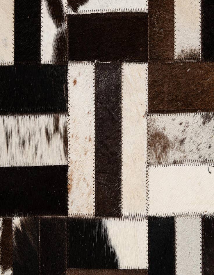 Detail image of  5' 1 x 7' 11 Cowhide - Patchwork Rug