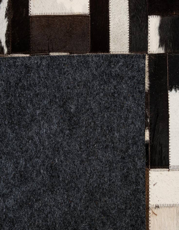 Detail image of  5' 1 x 7' 11 Cowhide - Patchwork Rug
