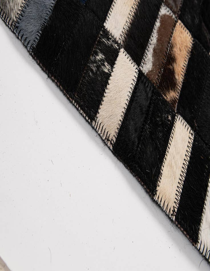 Detail image of  5' 2 x 7' 11 Cowhide - Patchwork Rug