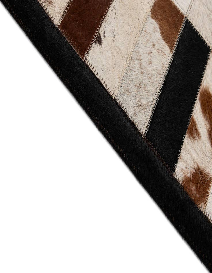 Detail image of  5' 2 x 7' 11 Cowhide - Patchwork Rug